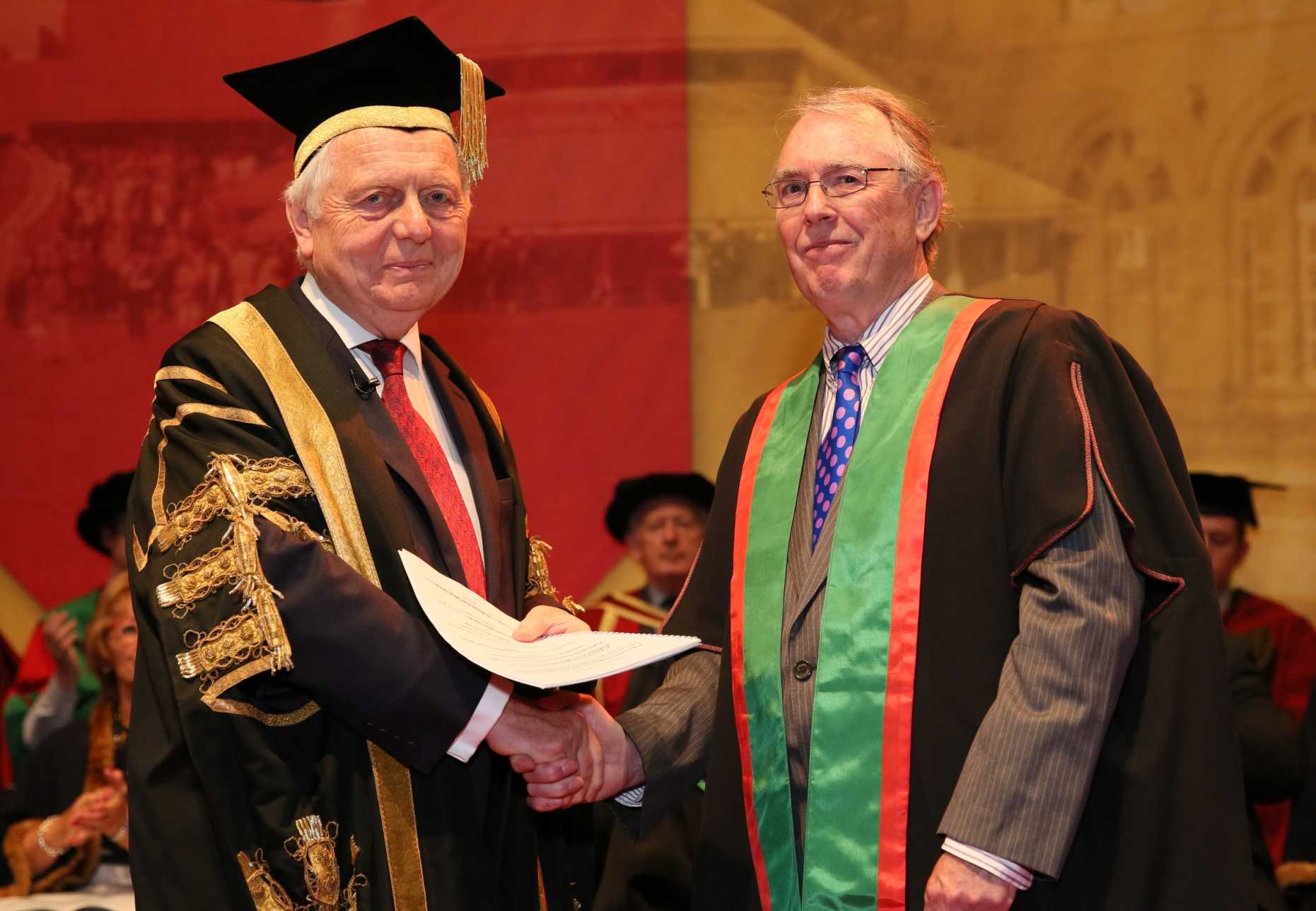 Enlarged view: Sir Emyr Jones Parry, Chancellor of Aberystwyth University presents an Honorary Doctorate to Professor Huw C. Davies