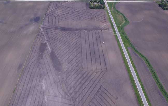 Enlarged view: Drainage infrastructure that might exist under a typical farm field. Drainage keeps soils dry enough for farmers to cultivate crops in soil that might be too wet otherwise. Image courtesy of Michael Castellano. 