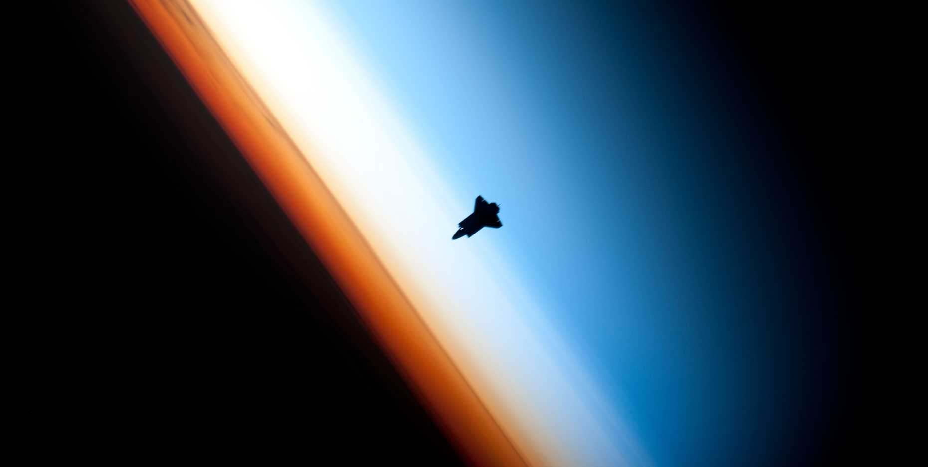 The Space Shuttle Endeavour orbiting at more than 200 miles in altitude and straddling the stratosphere and mesosphere. The orange layer is the troposphere, where all of the weather and clouds which we typically watch and experience are generated and contained. This orange layer gives way to the whitish Stratosphere and then into the Mesosphere. (Source: NASA/ STS-130 Shuttle Mission)